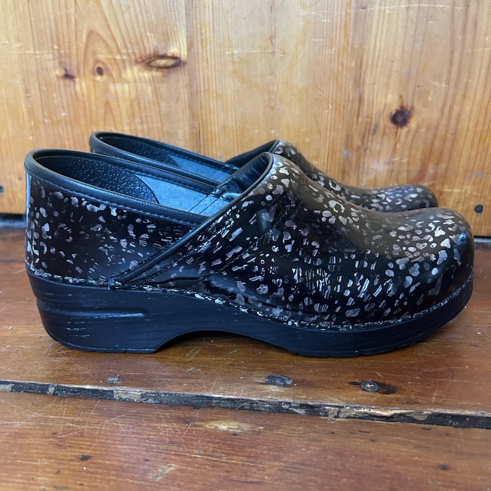 Dansko Black Brown Animal Print Clogs